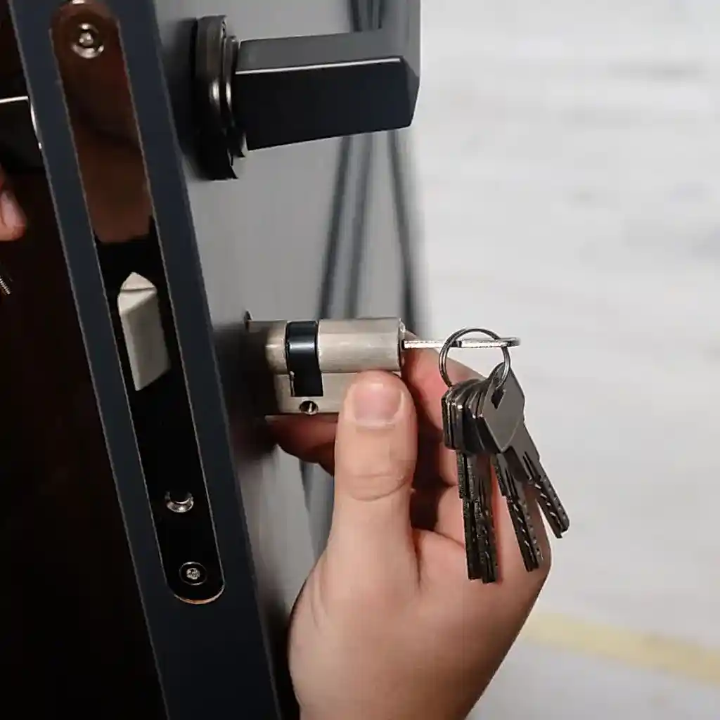Locksmith replacing a deadbolt on a Las Vegas home