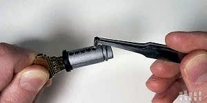 Locksmith rekeying a deadbolt cylinder with new pins at a Las Vegas home