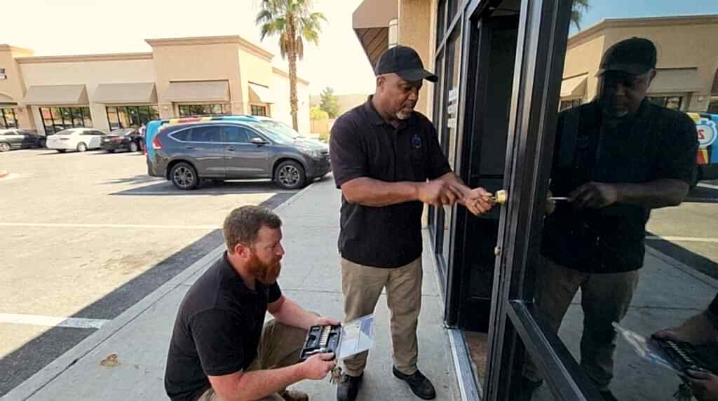 24/7 Locksmith 4U LV technicians rekeying a storefront door lock at an East Las Vegas strip plaza