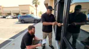 24/7 Locksmith 4U LV technicians rekeying a storefront door lock at an East Las Vegas strip plaza