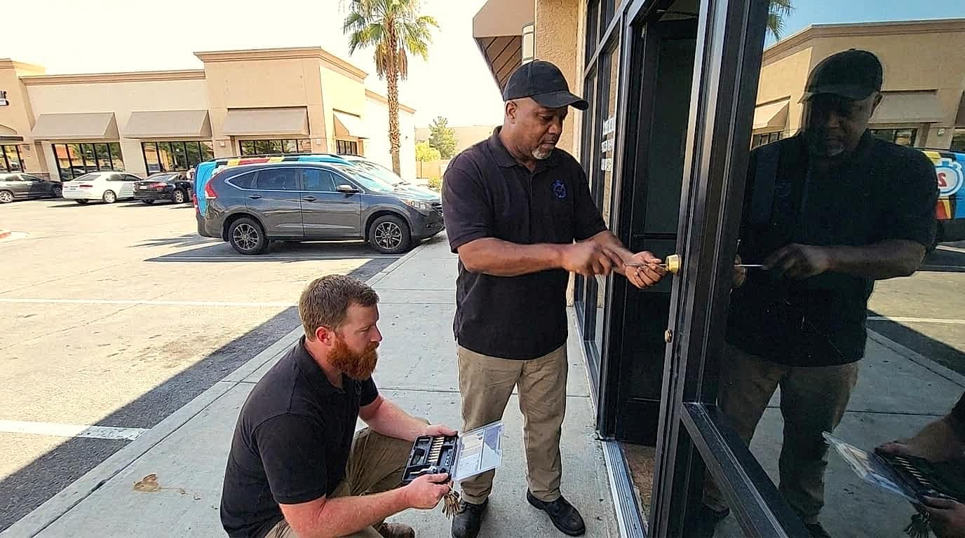 24/7 Locksmith 4U LV technicians rekeying a storefront door lock at an East Las Vegas strip plaza